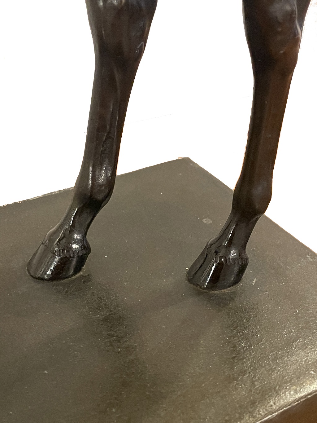 Standing mare, bronze, on flat rectangular