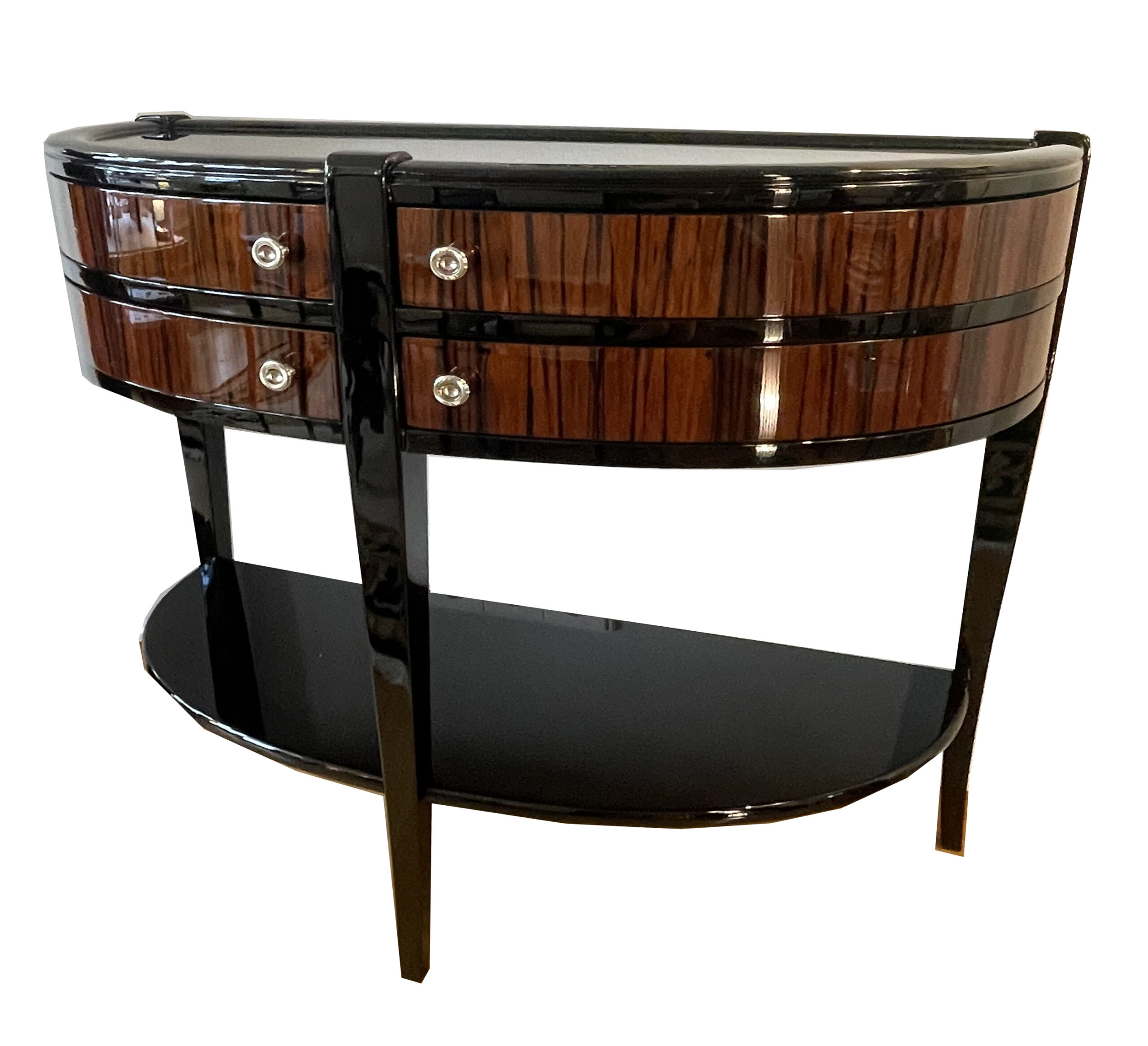 Makassar und Schwarzlack furniert.<br>Halbrunde Form mit 4 schwenkbaren Schubladen.<br>