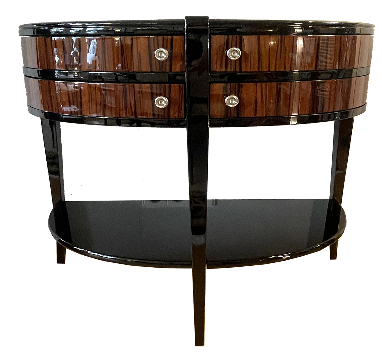 Makassar und Schwarzlack furniert.<br>Halbrunde Form mit 4 schwenkbaren Schubladen.<br>