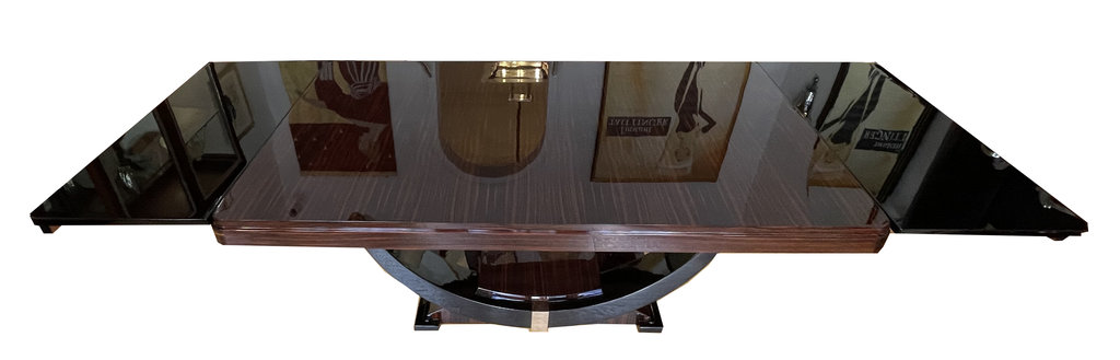 Art Deco dining table in Makassar ebony, accented with black lacquer and chrome – extendable – gondola-style base, France, circa 1930. Two black-stained extension leaves fit into the side pull-outs, adding 50 cm of length to each side—resulting in a total length of 280 cm.