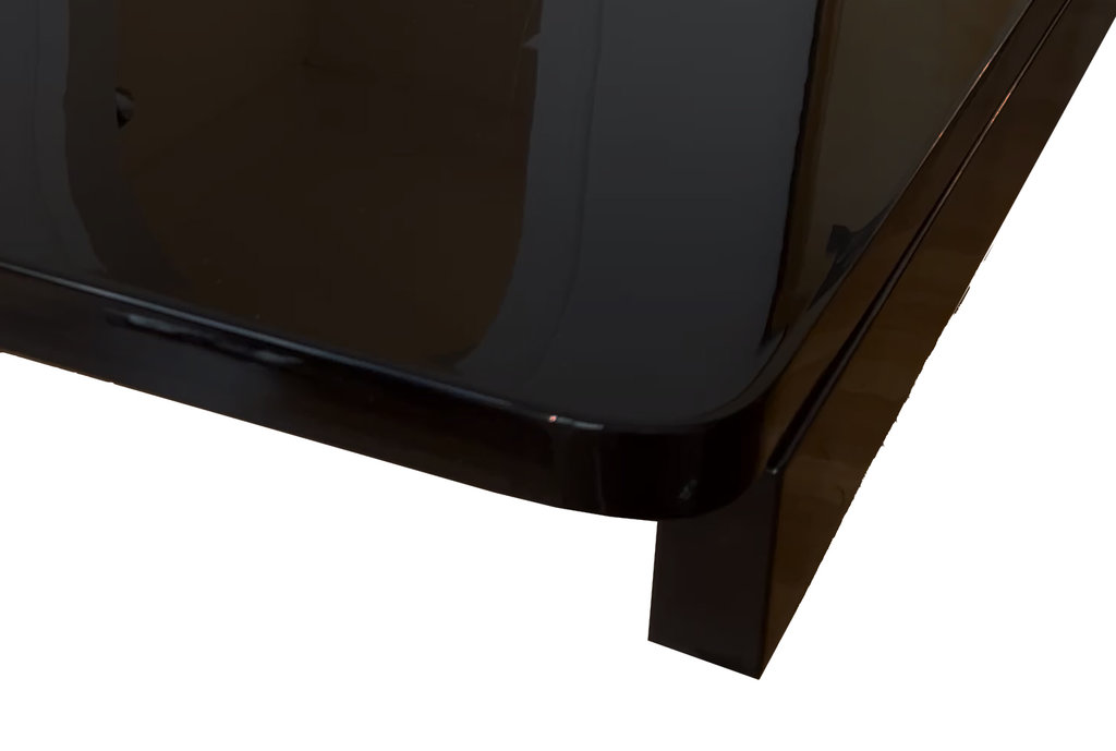 Art Deco dining table in Makassar ebony, accented with black lacquer and chrome—extendable—with gondola-style base; France, circa 1930. Two black-finished extension leaves fit into the pull-out sections at the ends, adding 50 cm of length to each side—resulting in a total length of 280 cm.