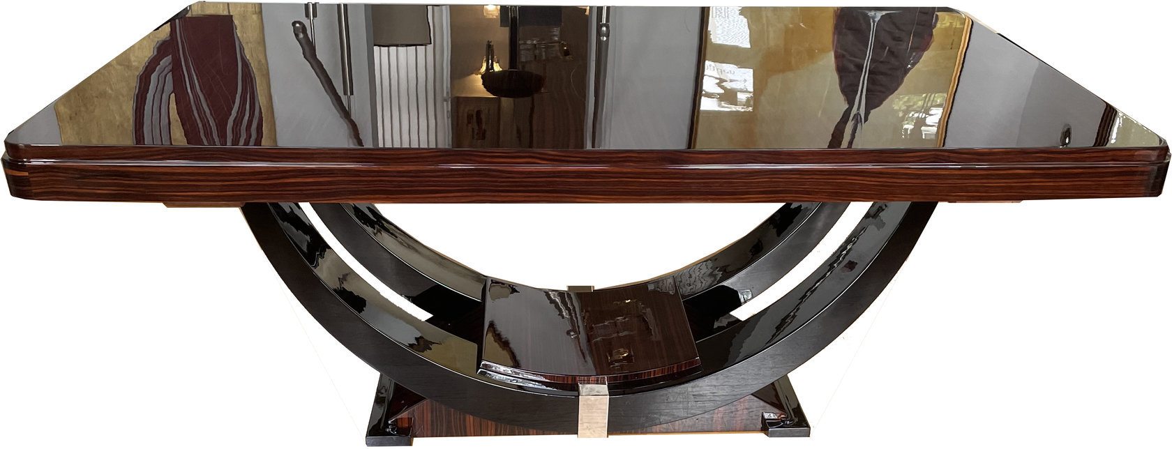 Art Deco dining table in Makassar ebony, accented with black lacquer and chrome – extendable – gondola-style base, France, circa 1930.