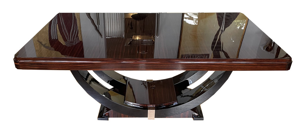 Art Deco dining table in Macassar ebony with black lacquer and chrome accents – extendable – gondola-style base, France, circa 1930. Table of this design seats 8–10 people.