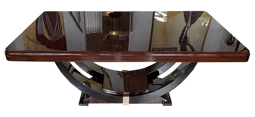 Art Deco dining table in Makassar ebony, accented with black lacquer and chrome – extendable – gondola-style base, France, circa 1930.