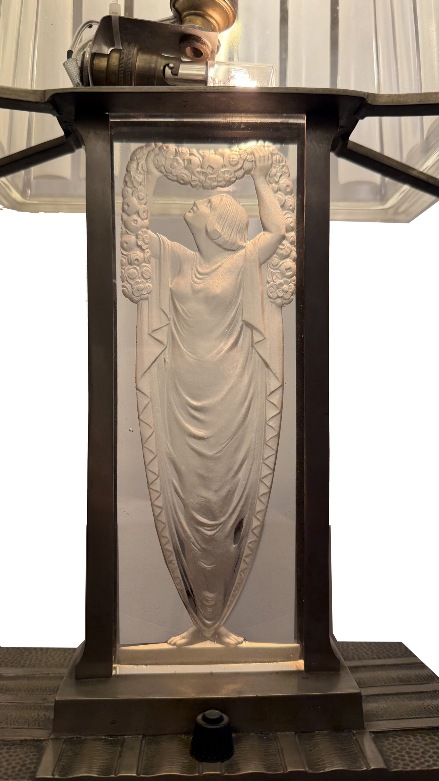 Signed French Art Deco table lamp showing its stepped glass shade and rectangular base