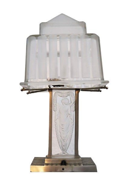 Front view of an Art Deco table lamp with a ribbed glass shade and female figure on the stem